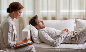 A man in a hypnotherapy session represents harnessing emotional intelligence with hypnotherapy to unlock personal insight and growth.
