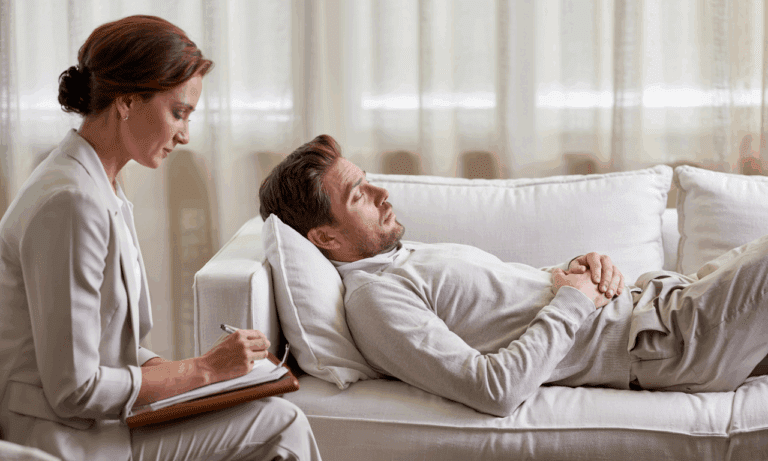 A man in a hypnotherapy session represents harnessing emotional intelligence with hypnotherapy to unlock personal insight and growth.