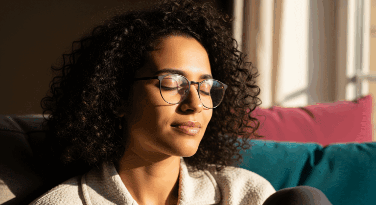 Relaxed woman at home with eyes closed representing self acceptance hypnotherapy