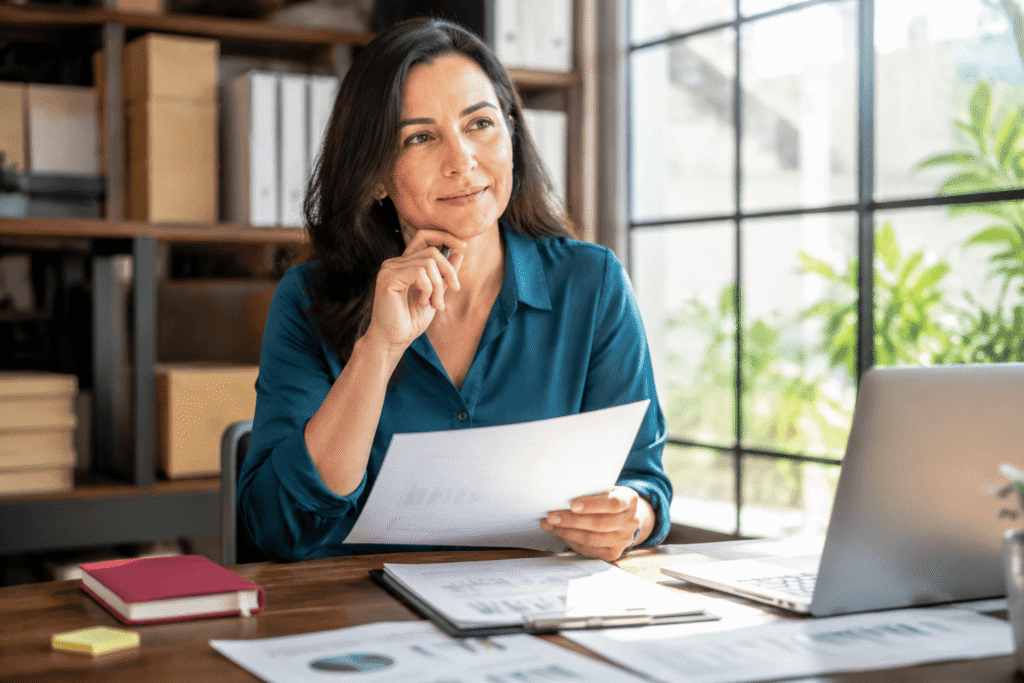 Business professional reviewing plans while moving forward after setbacks