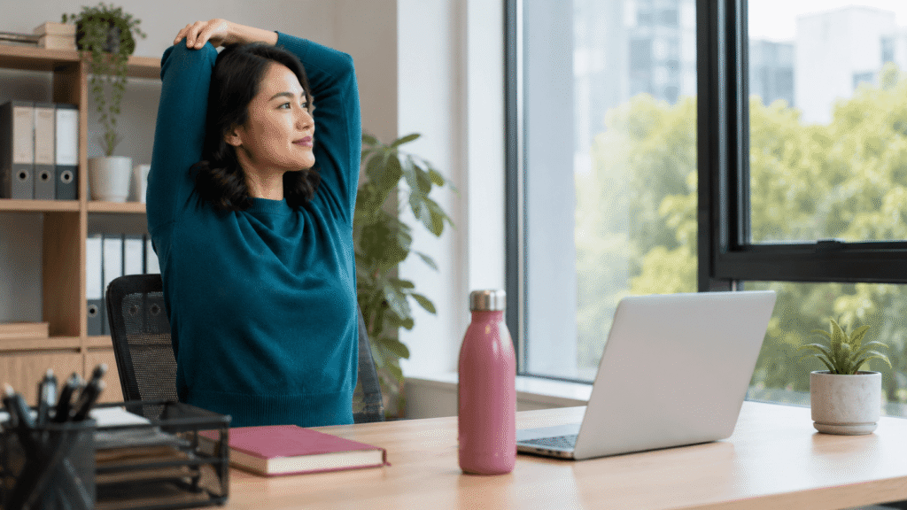 Professional working at a desk while managing focus and productivity