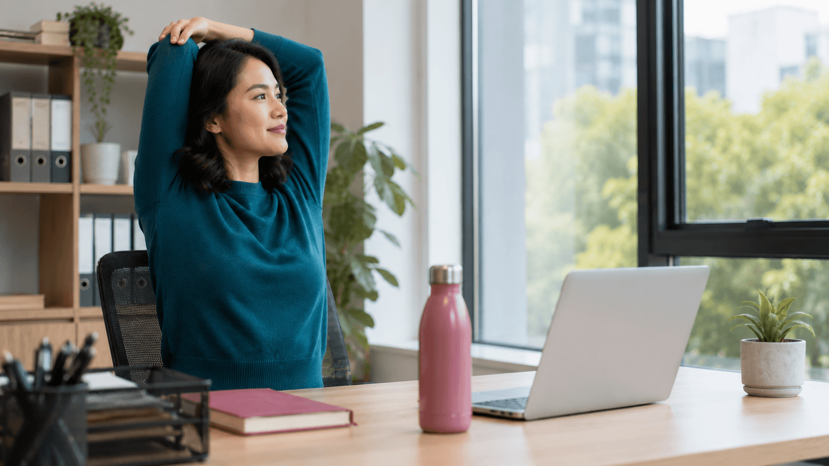 Professional working at a desk while managing focus and productivity